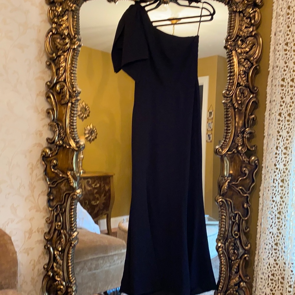 Woman’s black one shoulder gown